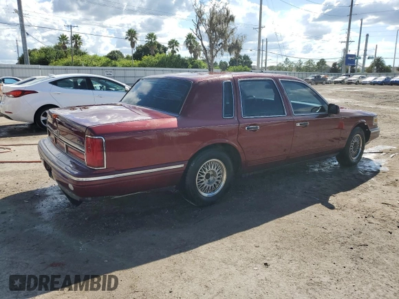 1996 Lincoln Town Car Signature z VIN 1LNLM82W3TY725921, wystawiony jako Copart lot #72569054 z przebiegiem 109 073 mil mil oraz Szkoda całkowita • Salvage title. Historia ofert i sprzedaży dostępna na DreamBid. Obrazek 3.