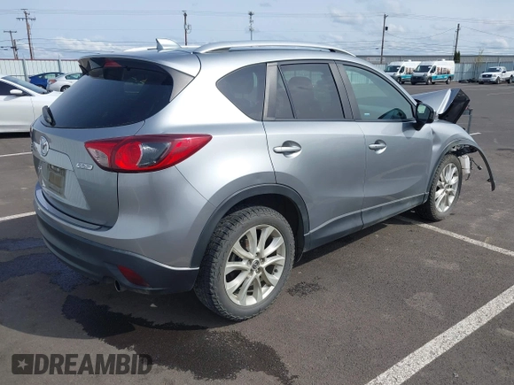 2014 Mazda CX-5 Grand Touring with VIN JM3KE4DY9E0375014, listed as a IAAI auction lot 42000382 with 110,584 mi miles and . Bid and sale history available at DreamBid. Image 4.