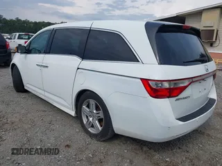2011 Honda Odyssey Touring with VIN 5FNRL5H90BB066177, listed as a IAAI auction lot 42053368 with 239,205 mi miles and . Bid and sale history available at carsss.com. Image 3.