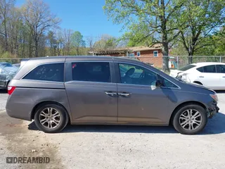 2011 Honda Odyssey EX-L with VIN 5FNRL5H60BB072101, listed as a IAAI auction lot 42002097 with 243,607 mi miles. Bid and sale history available at carsss.com. Image 13.