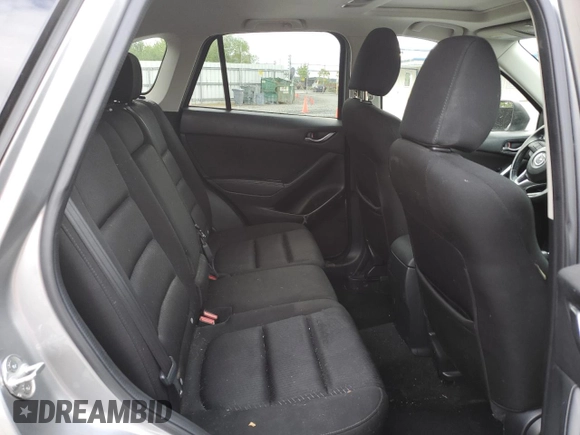 2014 Mazda CX-5 Touring z VIN JM3KE4CY0E0407169, wystawiony jako Copart lot #57877215 z przebiegiem 168 277 mil mil oraz Szkoda całkowita • Salvage title. Historia ofert i sprzedaży dostępna na DreamBid. Obrazek 11.