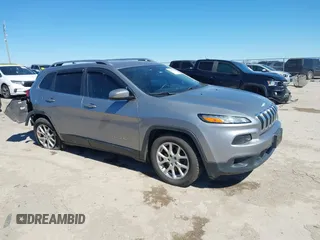 2016 Jeep Cherokee 75th Anniversary with VIN 1C4PJLCB1GW217638, listed as a IAAI auction lot 41689623 with 124,630 mi miles. Bid and sale history available at carsss.com. Image 1.