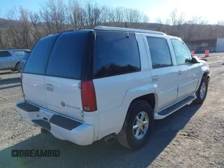 2000 Cadillac Escalade z VIN 1GYEK63R7YR219133, wystawiony jako IAAI lot #41585673 z przebiegiem 184 738 mil mil oraz . Historia ofert i sprzedaży dostępna na DreamBid. Obrazek 4.