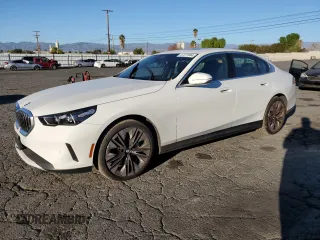 2024 BMW 5 Series 530i with VIN WBA43FJ0XRCS05943, listed as a Copart auction lot 87277084 with 4,924 mi miles and Salvage Title. Bid and sale history available at carsss.com. Image 1.