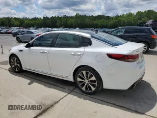 2016 Kia Optima SXL Turbo with VIN 5XXGV4L21GG015880, listed as a Copart auction lot 56623315 with 134,632 mi miles and Salvage title. Bid and sale history available at DreamBid. Image 2.