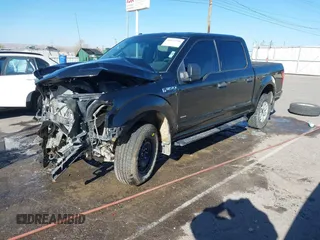 2015 Ford F-150 XLT with VIN 1FTEW1EP0FFC39327, listed as a IAAI auction lot 41012296 with 198,611 mi miles. Bid and sale history available at carsss.com. Image 2.