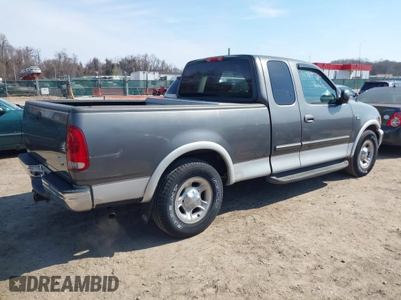 2003 Ford F-150 XL with VIN 1FTRX17L33NB61748, listed as a IAAI auction lot 41789730 with 301,092 mi miles. Bid and sale history available at carsss.com. Image 4.