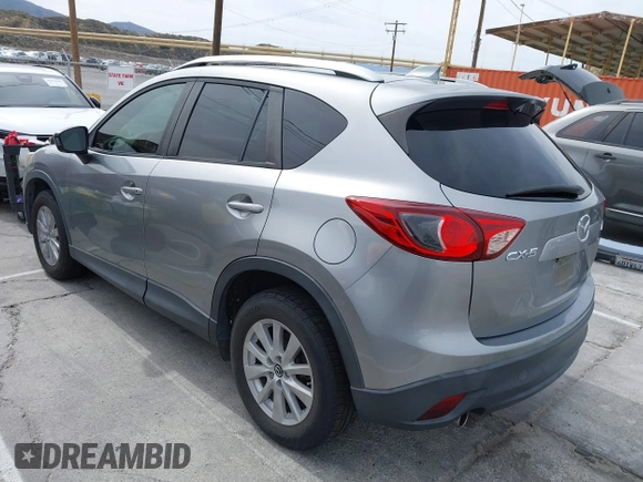 2014 Mazda CX-5 Touring with VIN JM3KE2CY3E0429025, listed as a IAAI auction lot 41680713 with 113,065 mi miles. Bid and sale history available at carsss.com. Image 3.