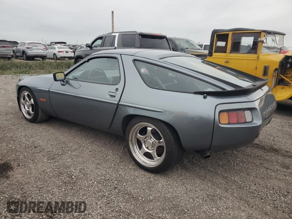 1983 Porsche 928 z VIN WP0ZZZ92ZDS841622, wystawiony jako Copart lot #76995304 z przebiegiem 83 862 mil mil oraz Szkody całkowita. Historia ofert i sprzedaży dostępna na DreamBid. Obrazek 2.