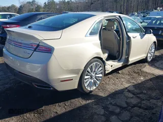 2016 Lincoln MKZ z VIN 3LN6L2G9XGR605070, wystawiony jako IAAI lot #41705442 z przebiegiem 136 565 mil mil oraz . Historia ofert i sprzedaży dostępna na DreamBid. Obrazek 4.
