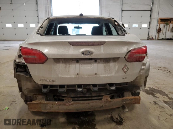 2018 Ford Focus SE z VIN 1FADP3F24JL315154, wystawiony jako Copart lot #53609185 z przebiegiem 76 216 mil mil oraz Szkoda całkowita • Salvage title. Historia ofert i sprzedaży dostępna na DreamBid. Obrazek 6.