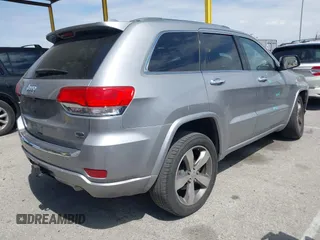 2014 Jeep Grand Cherokee Overland with VIN 1C4RJECG0EC291048, listed as a IAAI auction lot 41883941 with 81,871 mi miles. Bid and sale history available at carsss.com. Image 4.
