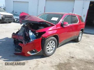 2021 Chevrolet Traverse LT Cloth with VIN 1GNEVGKW1MJ100973, listed as a IAAI auction lot 41477074 with 56,167 mi miles. Bid and sale history available at carsss.com. Image 2.