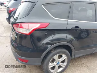 2013 Ford Escape SE with VIN 1FMCU0GX5DUB68604, listed as a IAAI auction lot 42126594 with 165,540 mi miles and . Bid and sale history available at carsss.com. Image 6.