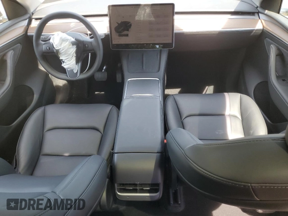 2024 Tesla Model Y with VIN 7SAYGDED6RF091715, listed as a Copart auction lot 56535585 with 23,120 mi miles and Salvage title. Bid and sale history available at DreamBid. Image 8.