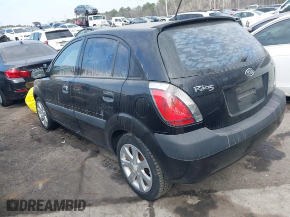 2009 Kia Rio LX with VIN KNADE243296481394, listed as a IAAI auction lot 41498863 with 59,222 mi miles. Bid and sale history available at carsss.com. Image 3.