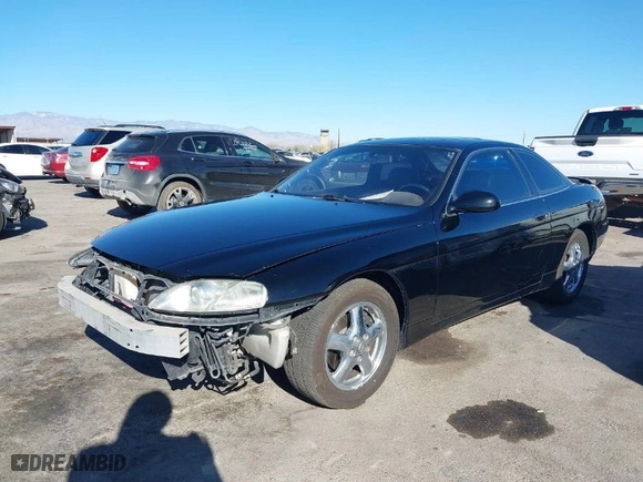 1999 Lexus SC 400 Luxury Sport Cpe with VIN JT8CH32Y4X1002413, listed as a IAAI auction lot 41331493 with 163,061 mi miles. Bid and sale history available at carsss.com. Image 2.