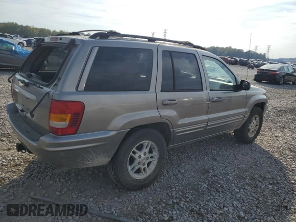 1999 Jeep Grand Cherokee Limited with VIN 1J4G268S7XC668348, listed as a Copart auction lot 77824084 with 165,779 mi miles and Salvage title. Bid and sale history available at DreamBid. Image 3.