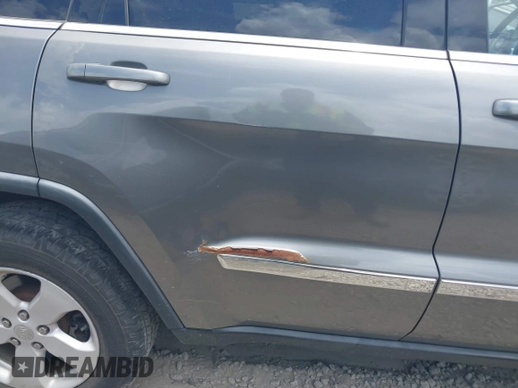 2011 Jeep Grand Cherokee Laredo with VIN 1J4RR4GG3BC595896, listed as a IAAI auction lot 42632333 with 135,426 mi miles and . Bid and sale history available at DreamBid. Image 6.