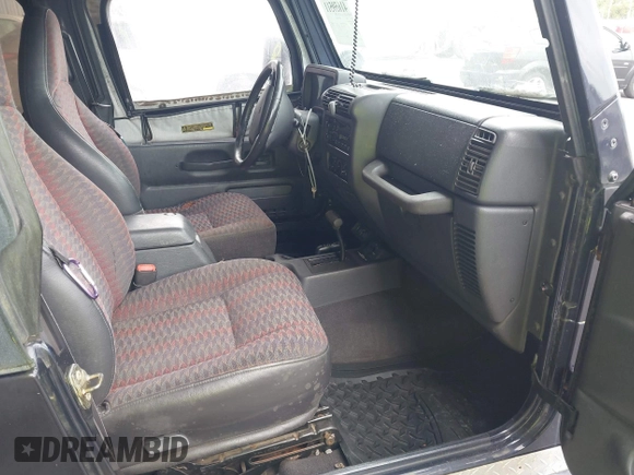 1999 Jeep Wrangler Sport with VIN 1J4FY19S1XP402974, listed as a IAAI auction lot 41659511 with 152,024 mi miles. Bid and sale history available at carsss.com. Image 5.