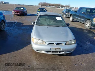 1999 Ford Escort SE with VIN 1FAFP13P8XW185612, listed as a IAAI auction lot 41097304 with 221,752 mi miles. Bid and sale history available at carsss.com. Image 6.