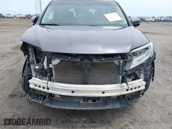 2019 Honda Pilot Touring 8-Passenger with VIN 5FNYF5H93KB028641, listed as a IAAI auction lot 42524078 with 56,744 mi miles and . Bid and sale history available at DreamBid. Image 18.