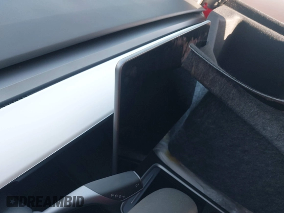 2023 Tesla Model 3 with VIN 5YJ3E1EA9PF695547, listed as a IAAI auction lot 40100334 with Not Provided miles and . Bid and sale history available at DreamBid. Image 7.