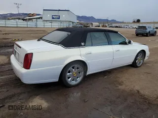 2004 Cadillac DeVille DTS z VIN 1G6KF57944U122824, wystawiony jako Copart lot #86147994 z przebiegiem 118 156 mil mil oraz Szkody całkowita. Historia ofert i sprzedaży dostępna na DreamBid. Obrazek 3.