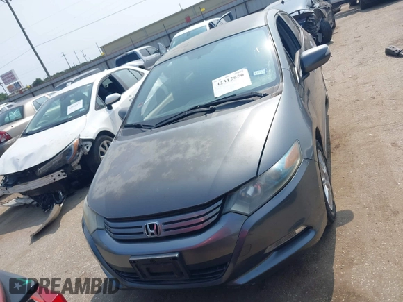 2010 Honda Insight EX with VIN JHMZE2H71AS043465, listed as a IAAI auction lot 42312556 with 151,009 mi miles and . Bid and sale history available at DreamBid. Image 12.