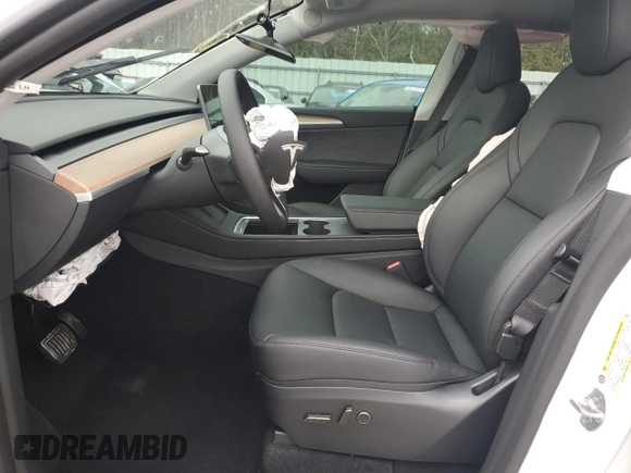 2025 Tesla Model Y Long Range with VIN 7SAYGDED3SA339079, listed as a Copart auction lot 82041424 with 1,793 mi miles and Salvage Title. Bid and sale history available at DreamBid. Image 7.
