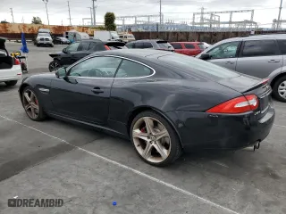 2013 Jaguar XK with VIN SAJWA4DC6DMB50779, listed as a Copart auction lot 50687705 with 106,826 mi miles and Clean Title. Bid and sale history available at carsss.com. Image 2.
