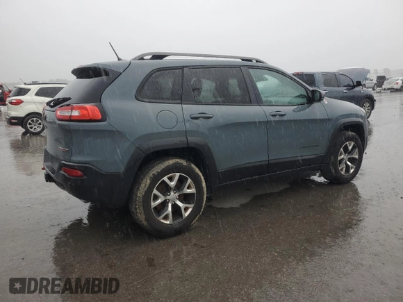 2014 Jeep Cherokee Trailhawk z VIN 1C4PJMBS7EW236960, wystawiony jako Copart lot #57098695 z przebiegiem 159 065 mil mil oraz Czysty tytuł • Clean title. Historia ofert i sprzedaży dostępna na DreamBid. Obrazek 3.