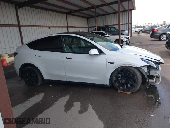 2023 Tesla Model Y Long Range with VIN 7SAYGAEE0PF787216, listed as a IAAI auction lot 41589954 with 17,985 mi miles and . Bid and sale history available at DreamBid. Image 14.