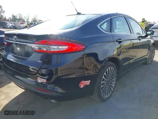 2017 Ford Fusion Energi SE with VIN 3FA6P0PU7HR373391, listed as a IAAI auction lot 41677525 with 99,499 mi miles. Bid and sale history available at carsss.com. Image 4.
