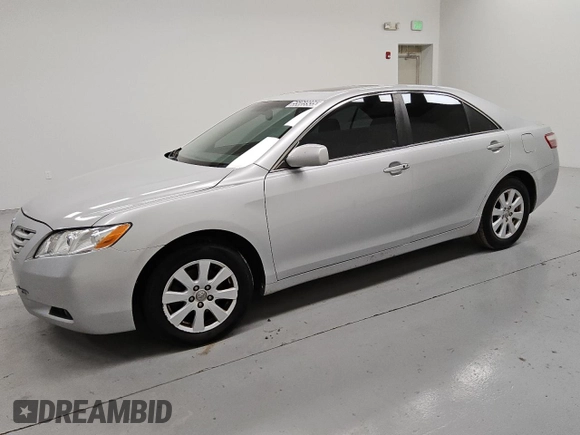 2009 Toyota Camry LE z VIN 4T1BK46K89U595880, wystawiony jako Copart lot #55069935 z przebiegiem 265 831 mil mil oraz Czysty tytuł • Clean title. Historia ofert i sprzedaży dostępna na DreamBid. Obrazek 1.