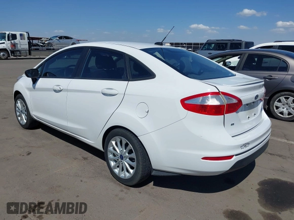 2014 Ford Fiesta SE z VIN 3FADP4BJ3EM183267, wystawiony jako IAAI lot #42058257 z przebiegiem 57 872 mil mil oraz . Historia ofert i sprzedaży dostępna na DreamBid. Obrazek 3.