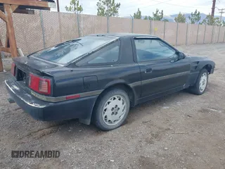 1986 Toyota Supra z VIN JT2MA70L4G0010843, wystawiony jako IAAI lot #41966751 z przebiegiem 205 187 mil mil oraz . Historia ofert i sprzedaży dostępna na DreamBid. Obrazek 4.
