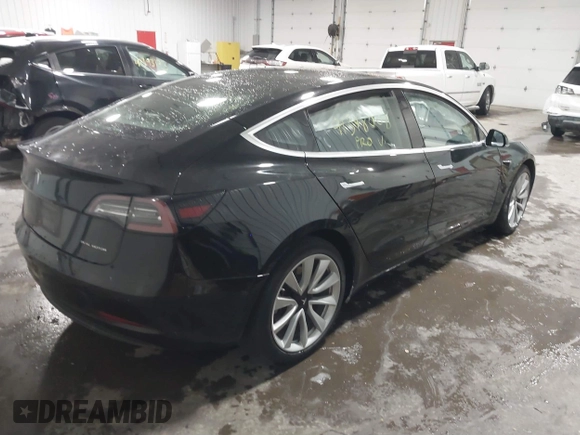 2018 Tesla Model 3 Long Range Battery with VIN 5YJ3E1EB7JF086778, listed as a IAAI auction lot 41348008 with 74,491 mi miles and . Bid and sale history available at DreamBid. Image 4.