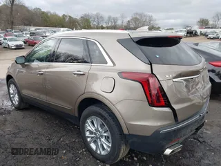 2023 Cadillac XT5 FWD Luxury z VIN 1GYKNAR45PZ140440, wystawiony jako IAAI lot #41723317 z przebiegiem 25 124 mil mil oraz . Historia ofert i sprzedaży dostępna na DreamBid. Obrazek 3.