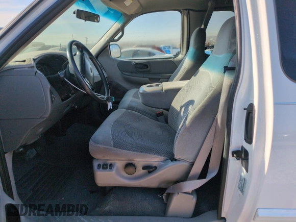 1999 Ford F-150 XL with VIN 1FTRX18L2XKA97143, listed as a Copart auction lot 52973695 with 115,180 mi miles and Salvage Title. Bid and sale history available at carsss.com. Image 7.