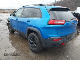 2018 Jeep Cherokee Trailhawk with VIN 1C4PJMBX3JD512813, listed as a IAAI auction lot 41457312 with 125,644 mi miles. Bid and sale history available at carsss.com. Image 3.