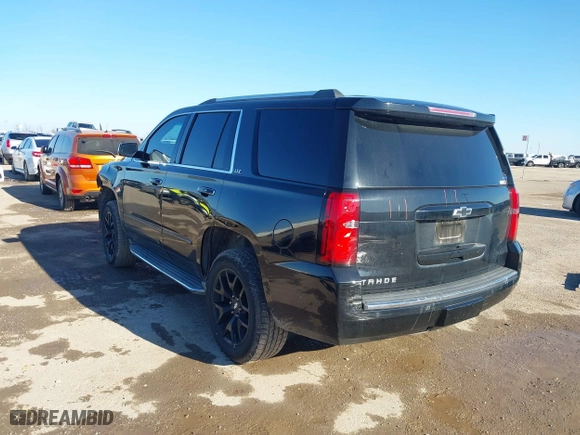 2015 Chevrolet Tahoe LTZ with VIN 1GNSCCKC4FR186632, listed as a IAAI auction lot 41482904 with 149,468 mi miles. Bid and sale history available at carsss.com. Image 3.