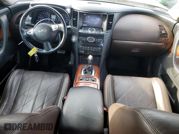 2015 Infiniti QX70 z VIN JN8CS1MUXFM381307, wystawiony jako Copart lot #47267545 z przebiegiem 171 240 mil mil oraz Szkoda całkowita • Salvage title. Historia ofert i sprzedaży dostępna na DreamBid. Obrazek 8.