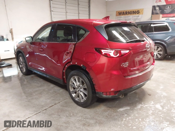 2020 Mazda CX-5 Grand Touring with VIN JM3KFBDM1L1809951, listed as a IAAI auction lot 41345854 with 117,376 mi miles. Bid and sale history available at carsss.com. Image 3.