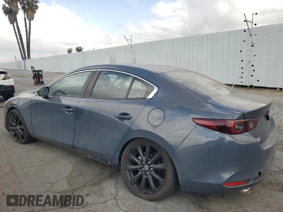 2024 Mazda 3 S Carbon Edition with VIN 3MZBPBCM0RM403689, listed as a Copart auction lot 54277935 with 7,040 mi miles and Salvage Title. Bid and sale history available at DreamBid. Image 2.