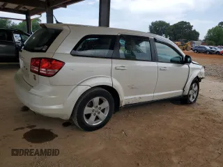 2013 Dodge Journey American Value with VIN 3C4PDCAB5DT656997, listed as a Copart auction lot 57123565 with 201,799 mi miles and Salvage title. Bid and sale history available at DreamBid. Image 3.