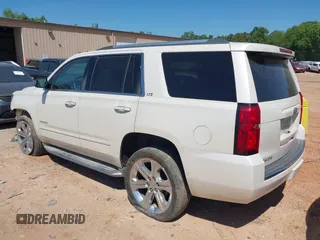 2015 Chevrolet Tahoe LTZ z VIN 1GNSKCKC7FR115444, wystawiony jako IAAI lot #42113903 z przebiegiem 162 383 mil mil oraz . Historia ofert i sprzedaży dostępna na DreamBid. Obrazek 3.
