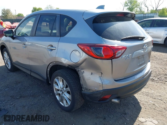 2014 Mazda CX-5 Grand Touring with VIN JM3KE4DY7E0311893, listed as a IAAI auction lot 42090872 with 102,154 mi miles and . Bid and sale history available at DreamBid. Image 18.