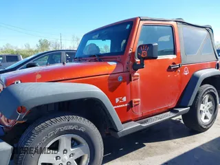2009 Jeep Wrangler X with VIN 1J4FA24139L738452, listed as a IAAI auction lot 42150358 with 237,647 mi miles and . Bid and sale history available at carsss.com. Image 14.