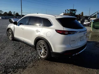 2017 Mazda CX-9 Grand Touring z VIN JM3TCADYXH0127867, wystawiony jako Copart lot #82352204 z przebiegiem 129 349 mil mil oraz Szkoda całkowita • Salvage title. Historia ofert i sprzedaży dostępna na DreamBid. Obrazek 2.